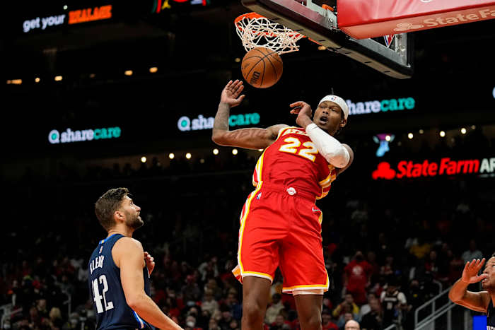 Atlanta Hawks forward Cam Reddish (22) dunks behind Dallas Mavericks forward Maxi Kleber (42) during the second half at State Farm Arena.